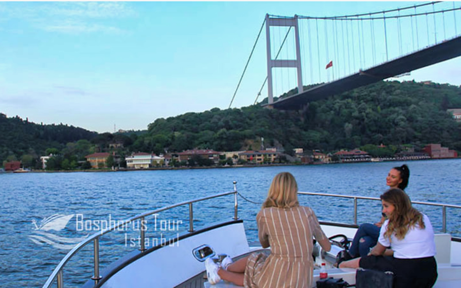 Boat tour on the Bosphorus with view of the Bosphorus Bridge in Istanbul.