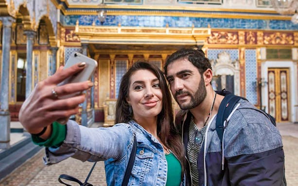 Visitors taking a selfie inside Topkapi Palace, Istanbul.