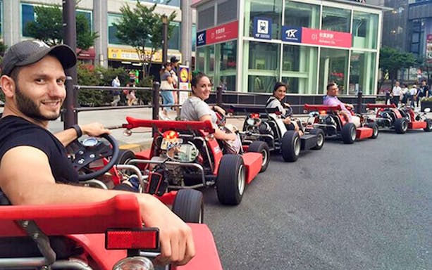 Participants in go-karts on a guided tour in Akihabara, Tokyo.