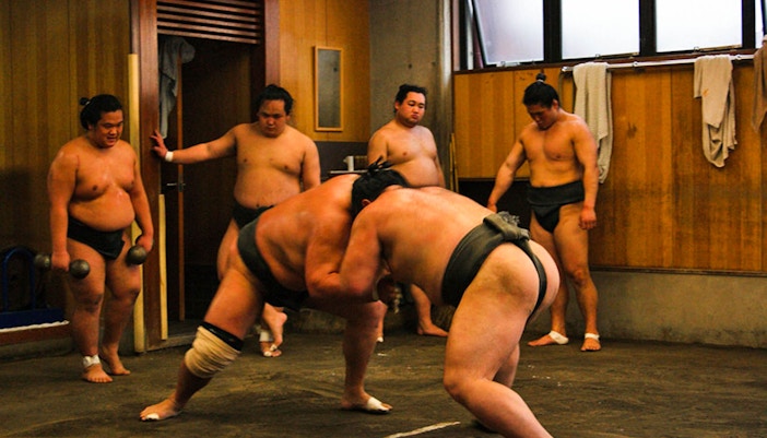 Sumo wrestlers practicing at a Tokyo sumo stable.