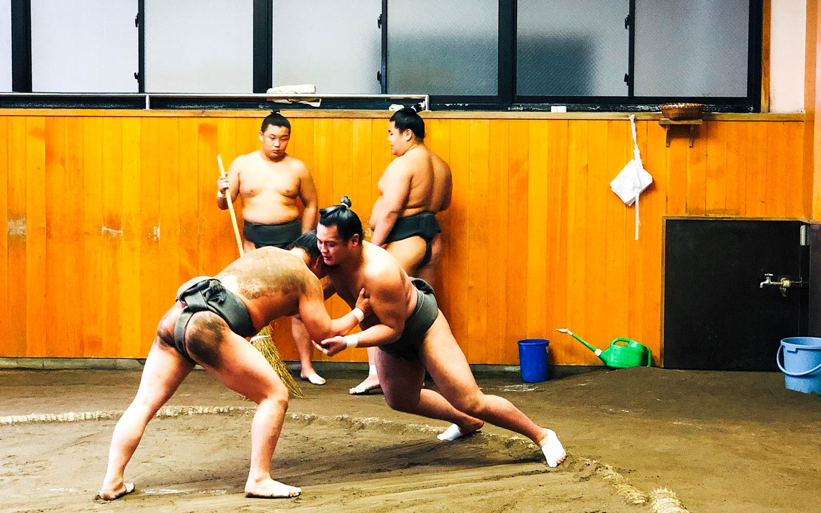 Sumo wrestlers practicing at a sumo stable in Tokyo.