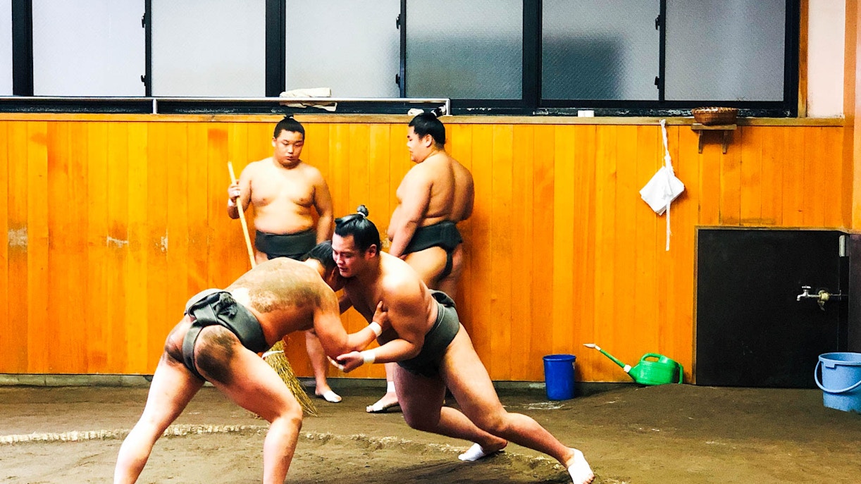 Sumo wrestlers practicing at a sumo stable in Tokyo.