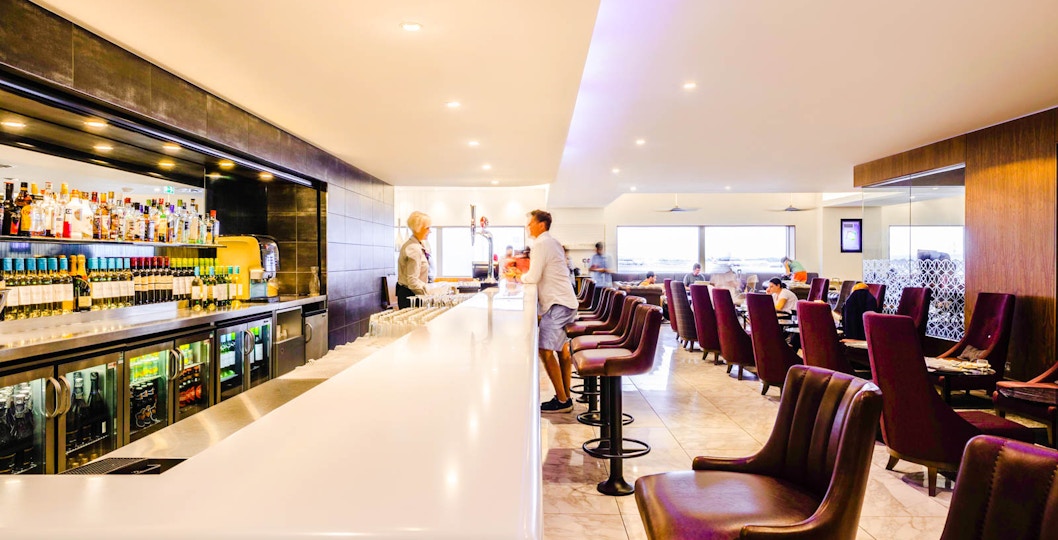 Bar area with seating and patrons.