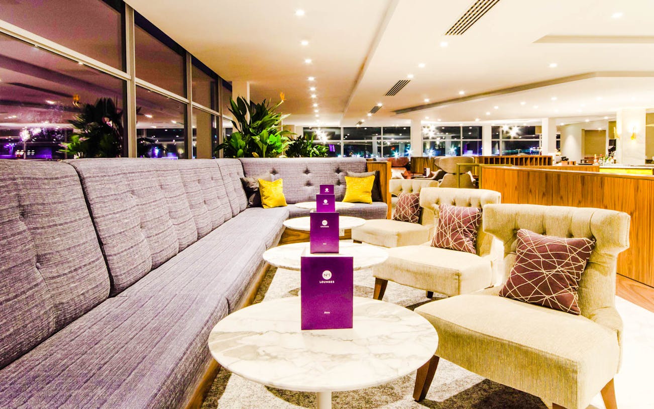 Gatwick Airport South Terminal lounge seating area with tables and chairs.