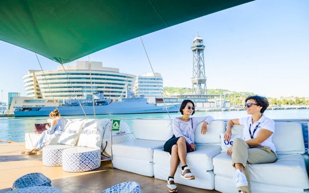 Sailing trip in Barcelona with views of the World Trade Center and Port Vell.
