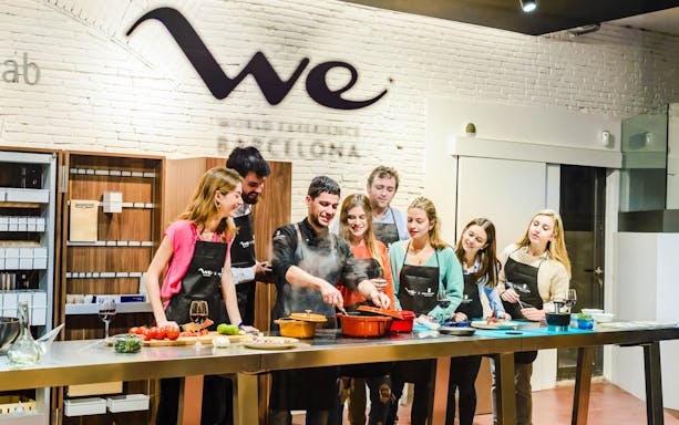 Cooking show with chef preparing tapas and cocktails in Barcelona.