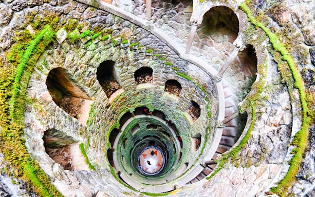 Quinta da Regaleira's Initiation Well with spiral staircase, Sintra, Portugal.