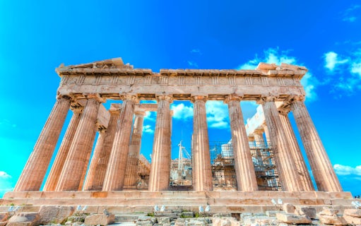 Parthenon temple on the Acropolis in Athens under a clear blue sky.