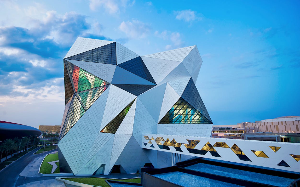 Clymb Abu Dhabi geometric building exterior with colorful glass panels.