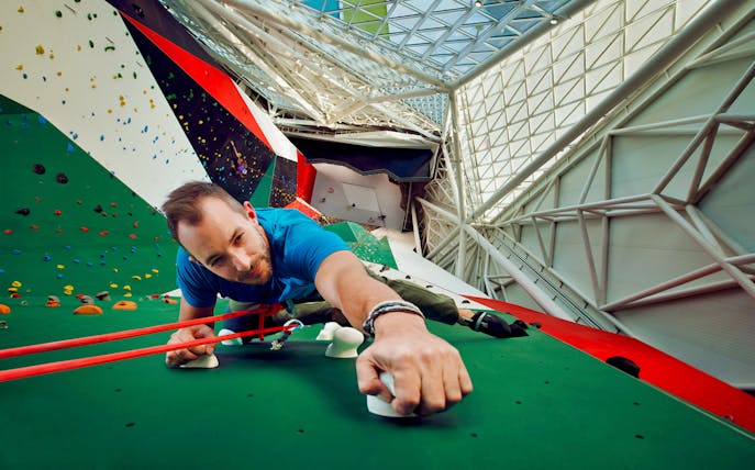 Indoor climber scaling wall at Clymb Abu Dhabi.