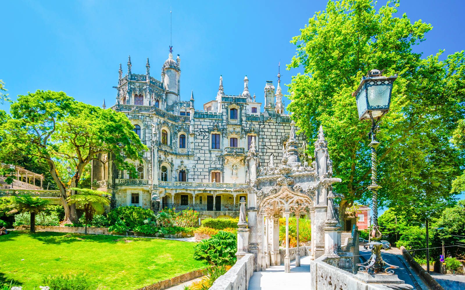 Quinta da Regaleira palace and gardens in Sintra, Portugal, on a sunny day.