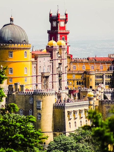 Pena Palace in Sintra, Portugal, viewed from a distance, part of Lisbon Card + Hop-On Hop-Off Bus Tour.