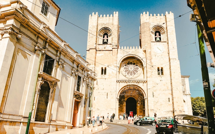 Lisbon Cathedral with tourists, part of Lisbon Card + 24hr Hop-On Hop-Off Bus Tour.