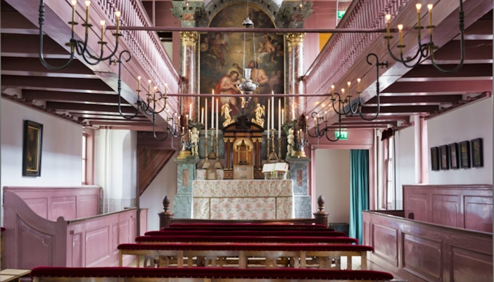 Our Lord in the Attic Museum chapel interior with altar and pews, Amsterdam.