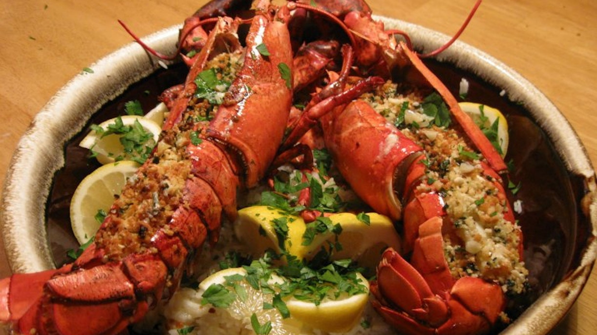 Lobster dinner with lemon wedges on a plate for Pedicab Tour.