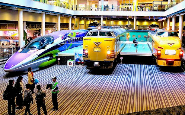 Kyoto Railway Museum trains display with visitors exploring exhibits.