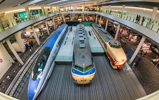 Kyoto Railway Museum interior with vintage trains on display.