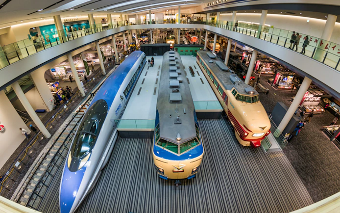 Kyoto Railway Museum interior with vintage trains on display.