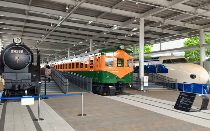 Steam, electric, and bullet trains displayed at Kyoto Railway Museum.