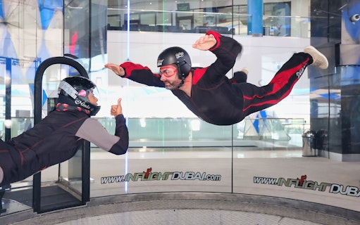 Indoor skydiving experience at In Flight Dubai with instructor guidance.