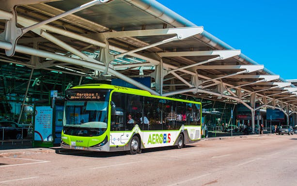 Aerobus Lisbon Airport Shuttle at terminal entrance.