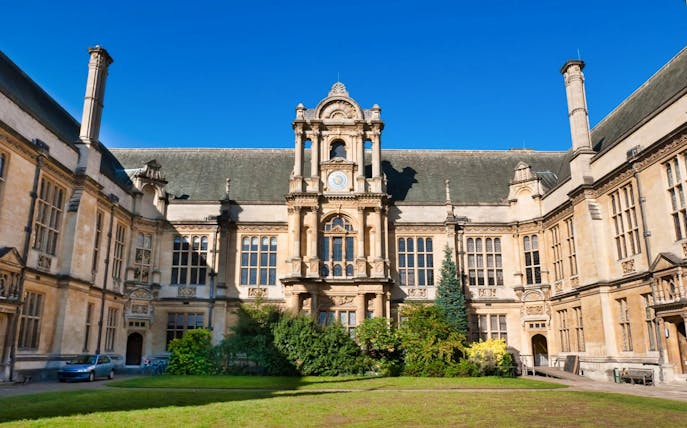 Historic building at Oxford University with ornate architecture and clock tower.