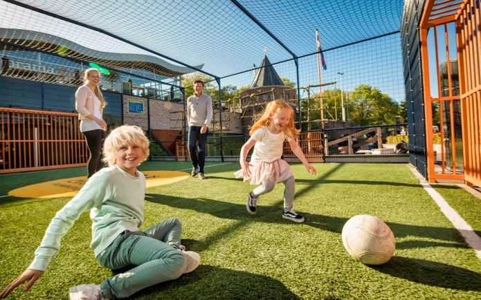 Children playing soccer at Madurodam Miniature Park, Netherlands.