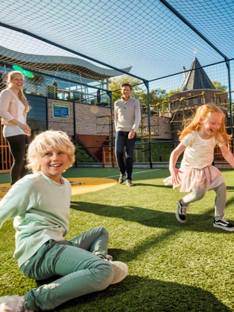 Children playing soccer at Madurodam Miniature Park, Netherlands.