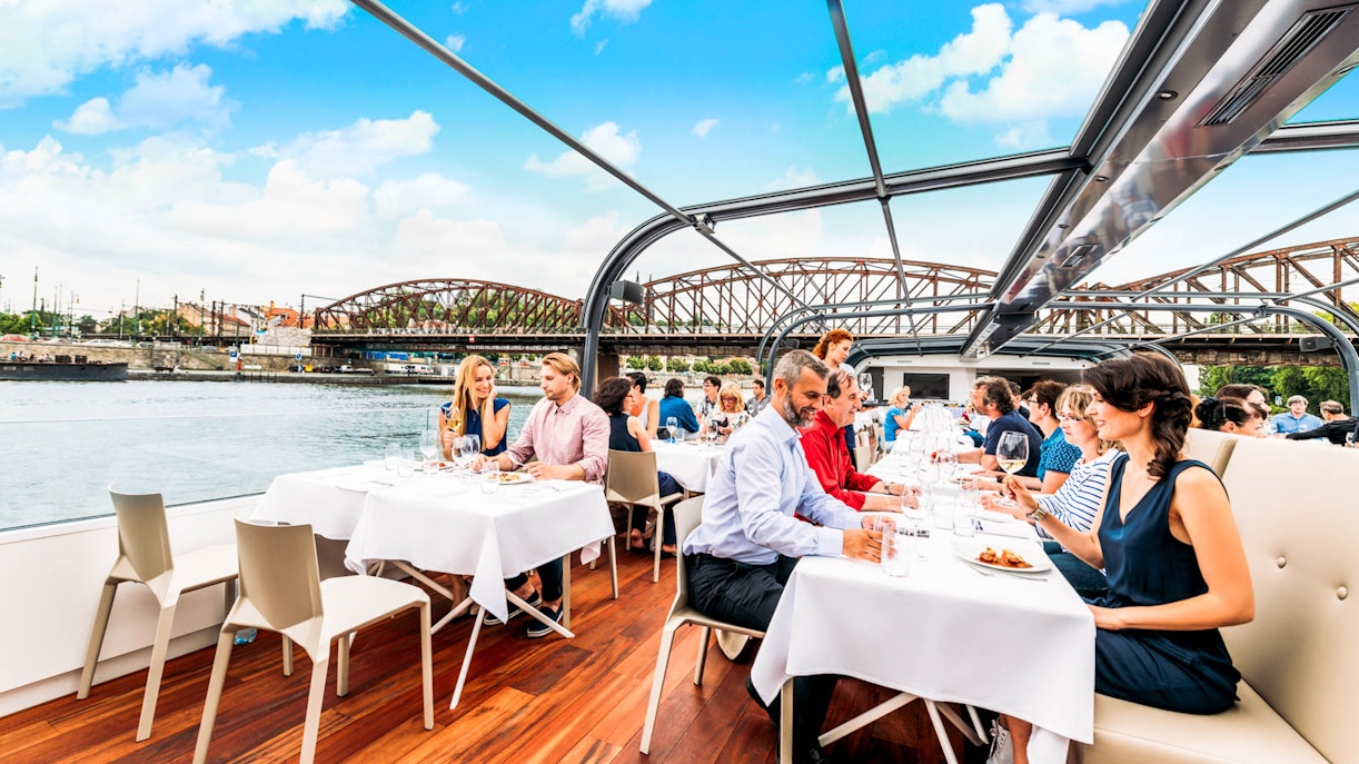 https://cdn-imgix.headout.com/tour/23245/TOUR-IMAGE/b2965e92-b81f-4ea7-8f07-1716c8d30453-12104-prague-prague--2hr-lunch-cruise-with-live-music-01.jpg
