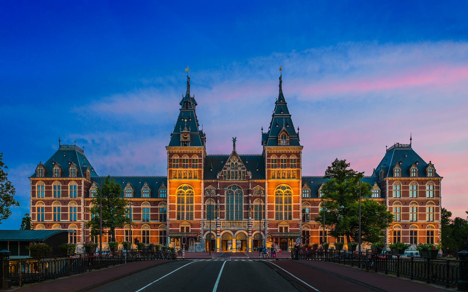 Rijksmuseum facade at sunset in Amsterdam, part of Skip the Line tour with 24 hr Hop On Hop Off Bus.
