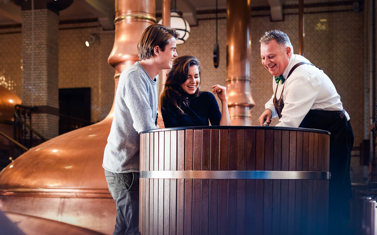Visitors enjoying a tour at the Heineken Experience brewery in Amsterdam.