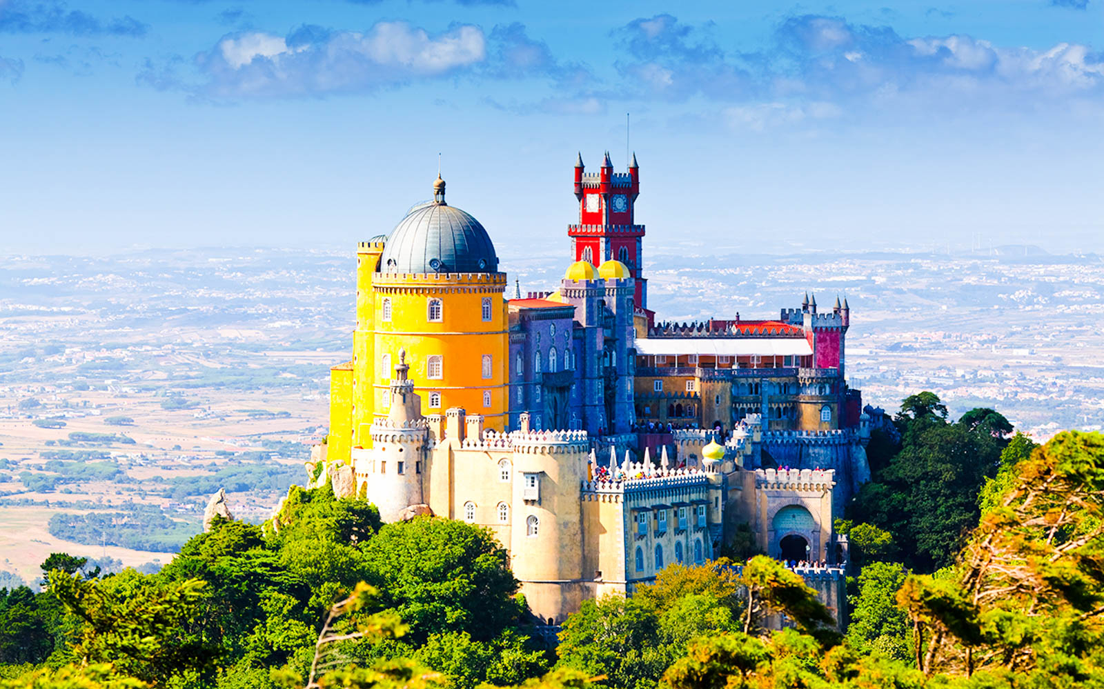Pena Palace in Sintra, Portugal, with vibrant colors and scenic landscape.