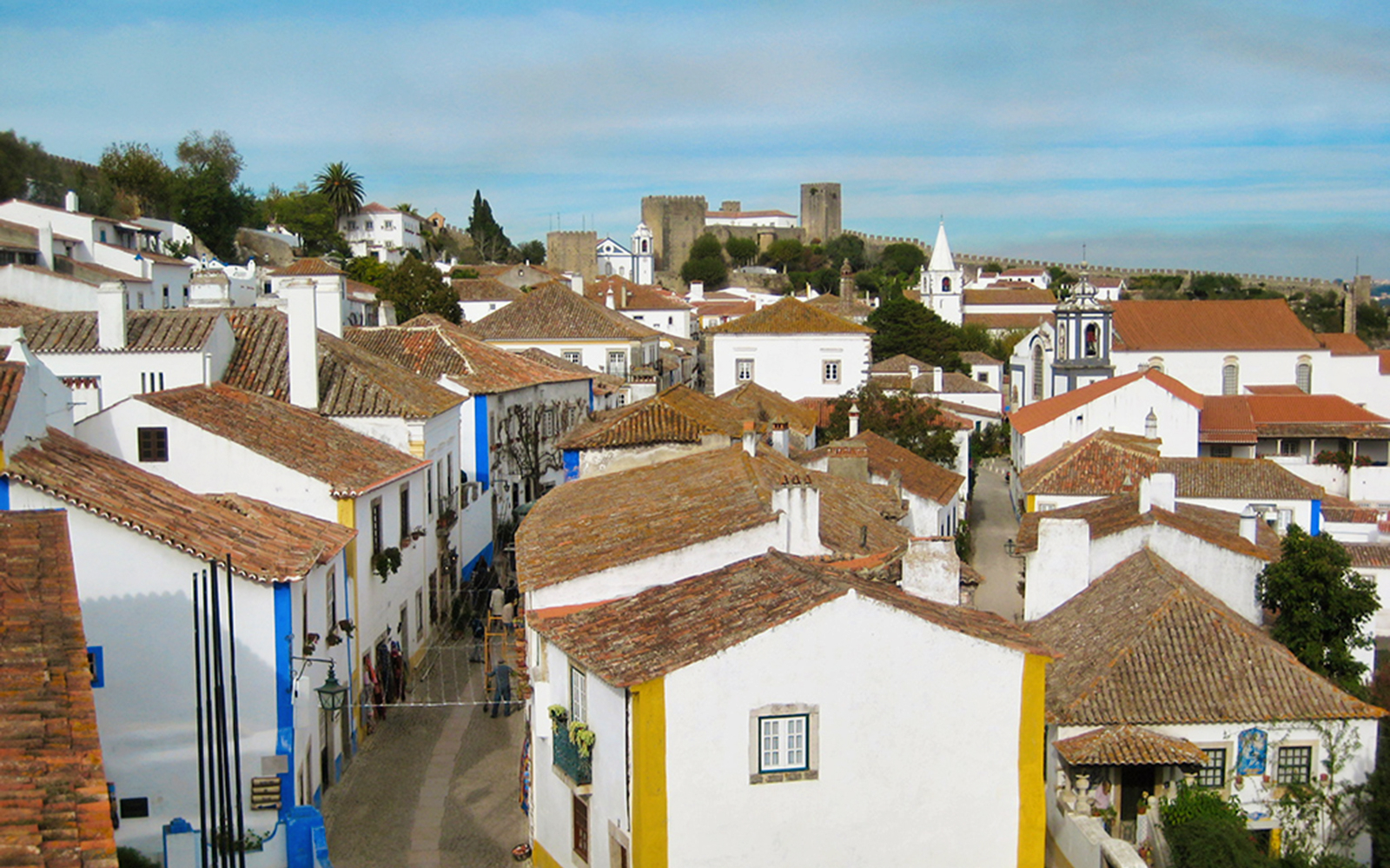 Óbidos village with medieval castle walls and traditional white houses, part of Lisbon day tour.