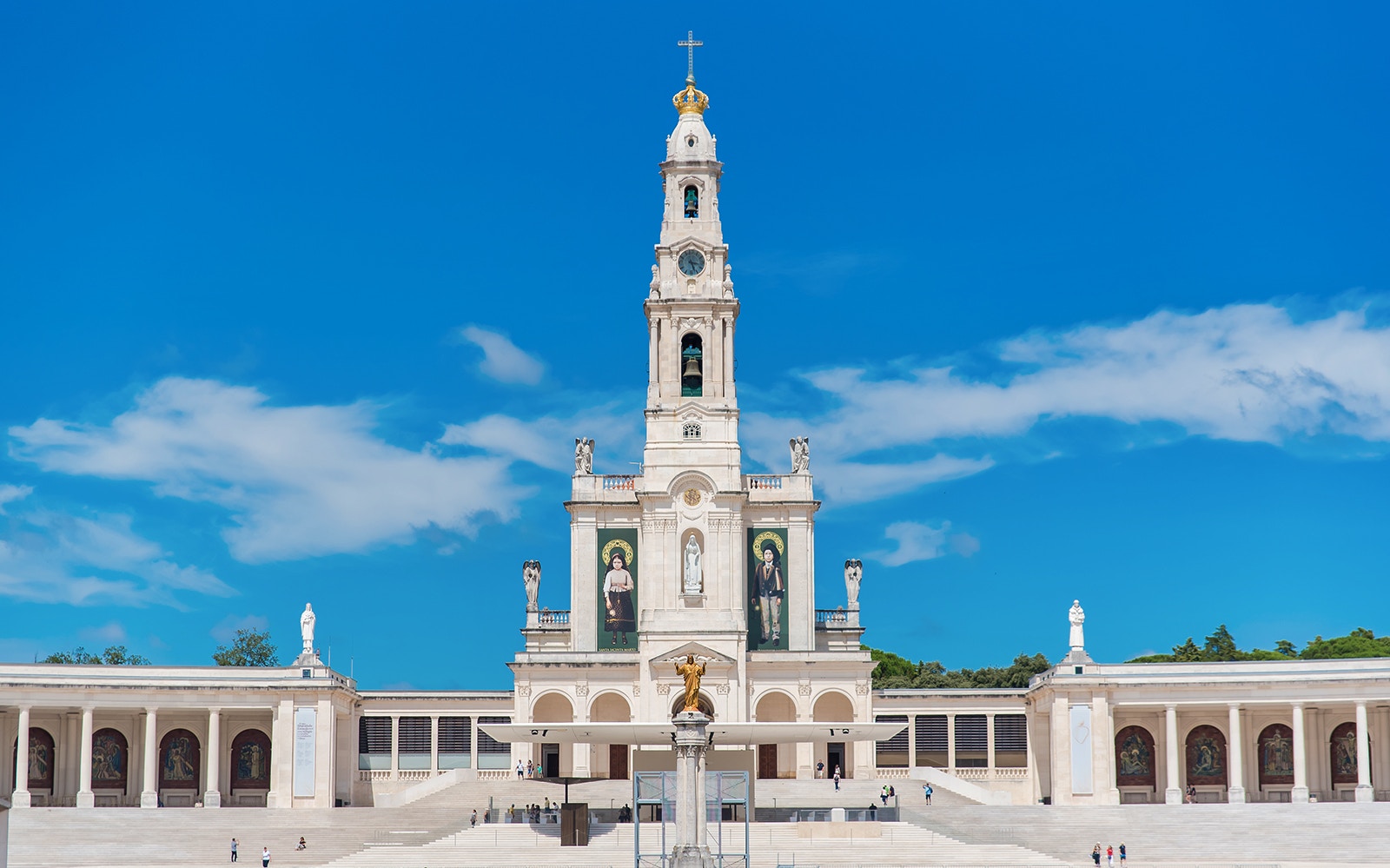 Sanctuary of Fátima basilica with blue sky, part of Fatima Highlights Guided Tour from Lisbon.