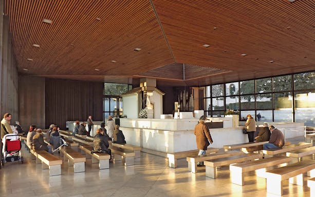 Visitors seated in the Chapel of Apparitions at Fátima during a half-day tour from Lisbon.