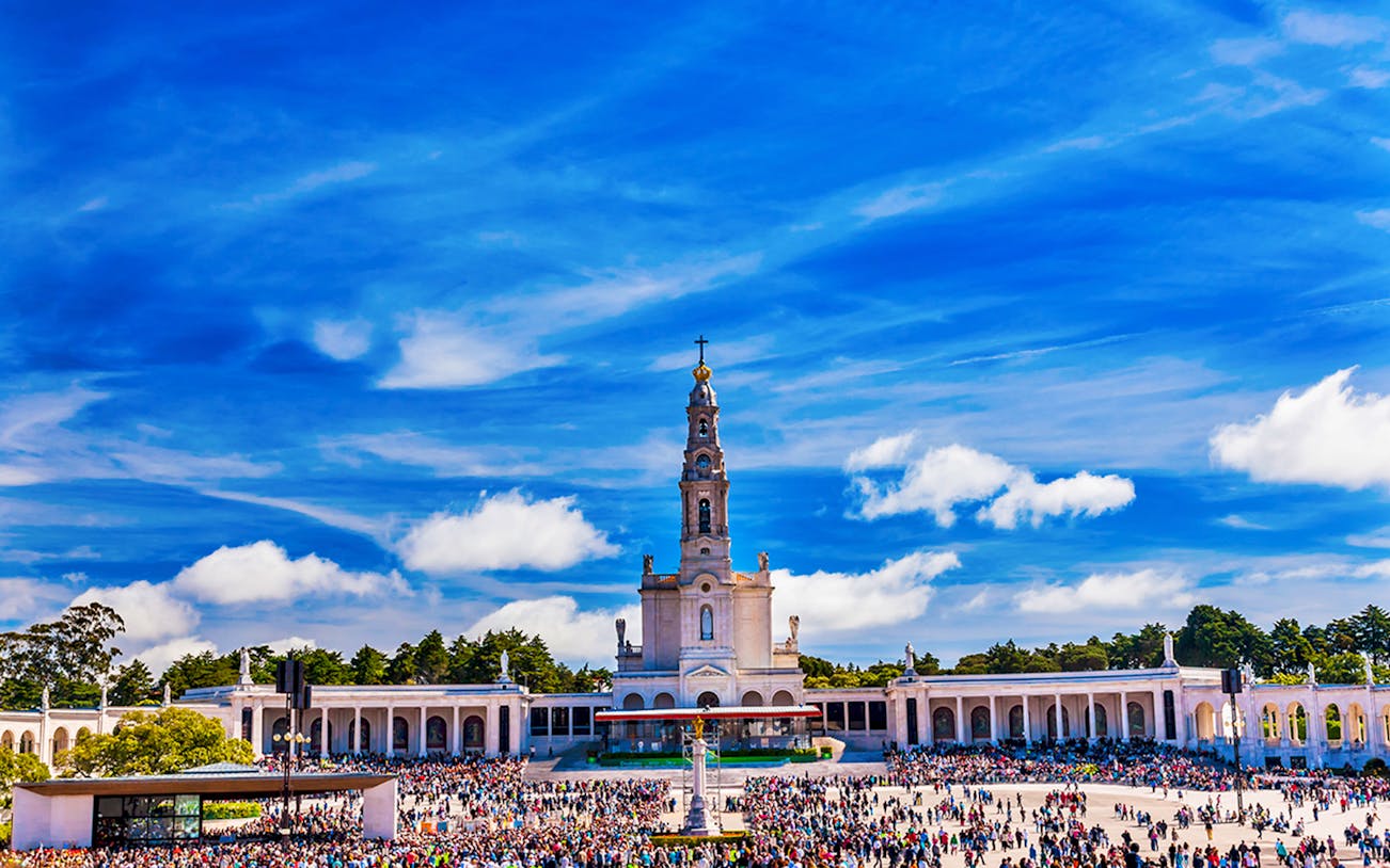 Fátima Sanctuary with crowds, part of a half-day guided tour from Lisbon.