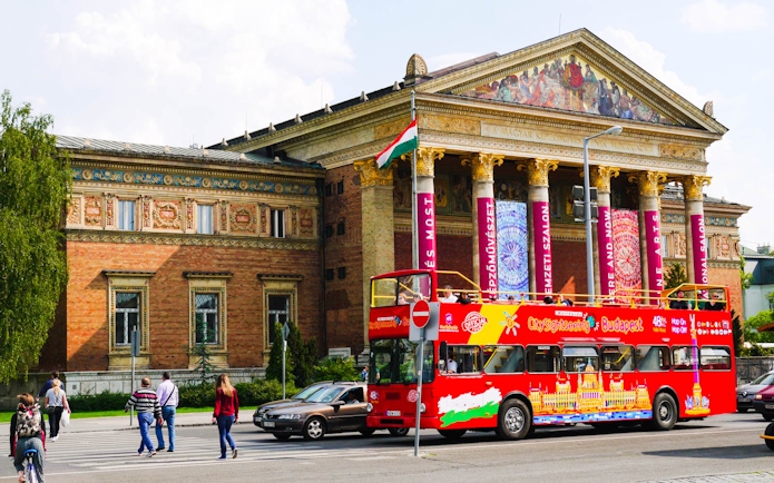 Open-top sightseeing bus in front of Budapest's Museum of Fine Arts.