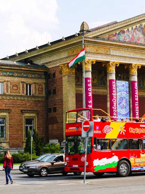 Open-top sightseeing bus in front of Budapest's Museum of Fine Arts.