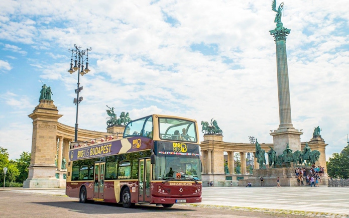 Hop-On Hop-Off bus in front of Millennium Monument, Budapest.