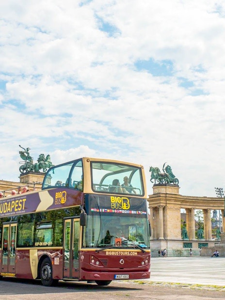 Hop-On Hop-Off bus in front of Millennium Monument, Budapest.