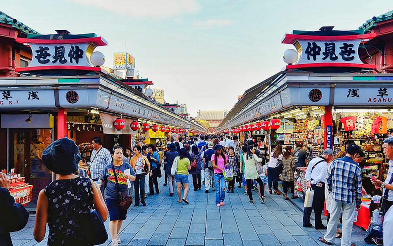 Crowds explore Nakamise Street in Asakusa, Tokyo, during a morning tour.