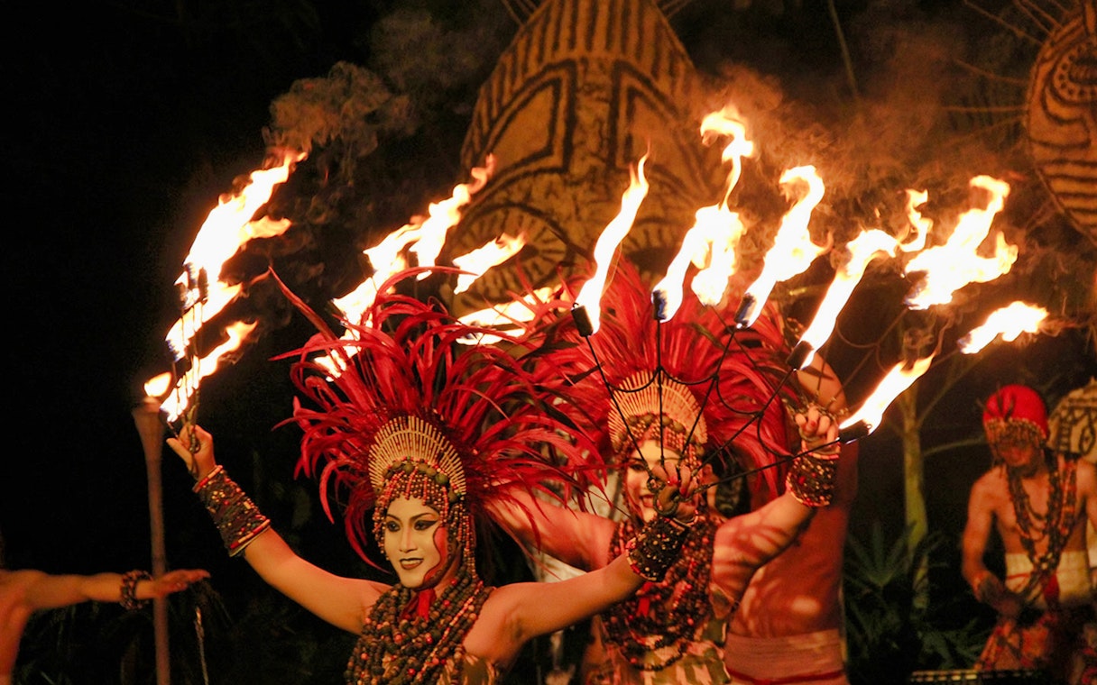 Fire dancers performing at Bali Safari and Marine Park night safari.