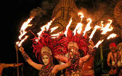Fire dancers performing at Bali Safari and Marine Park night safari.