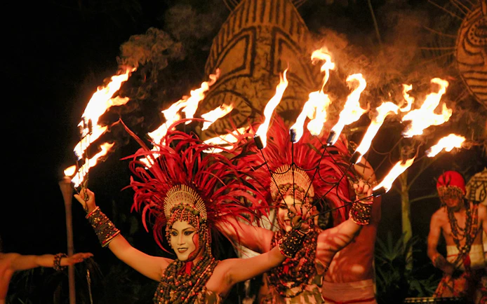 Fire dancers performing at Bali Safari and Marine Park night safari.