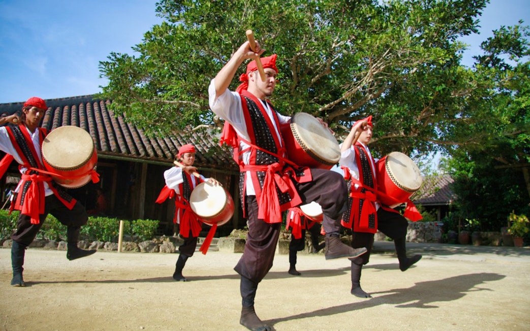 Drummers performing traditional dance at Okinawa Ryukyu Mura Village.