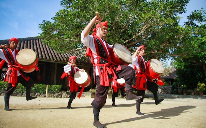 Drummers performing traditional dance at Okinawa Ryukyu Mura Village.
