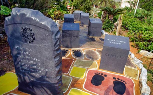 Stone monuments with inscriptions at Okinawa Fruits Land, Japan.