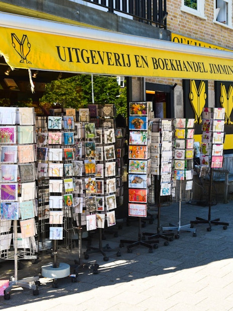 Bookstore with postcard racks in Amsterdam on Anne Frank Story & Neighbourhood Walking Tour.