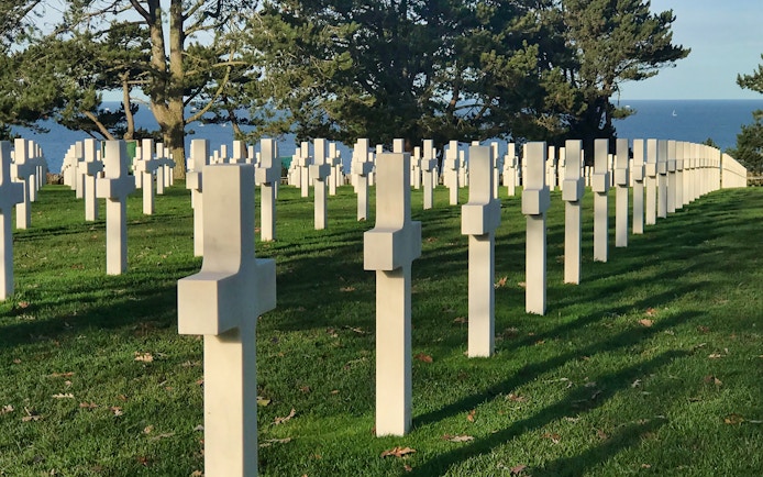 Normandy American Cemetery crosses overlooking the sea on a D-Day tour from Paris.