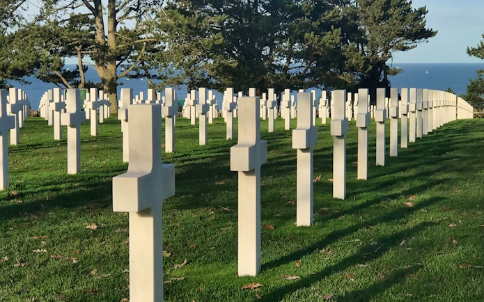 Normandy American Cemetery crosses overlooking the sea on a D-Day tour from Paris.